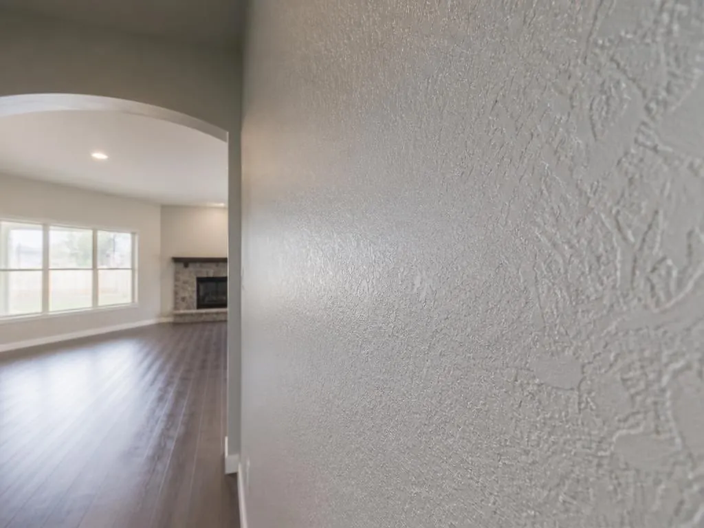 Finished and textured drywall wall in a home interior