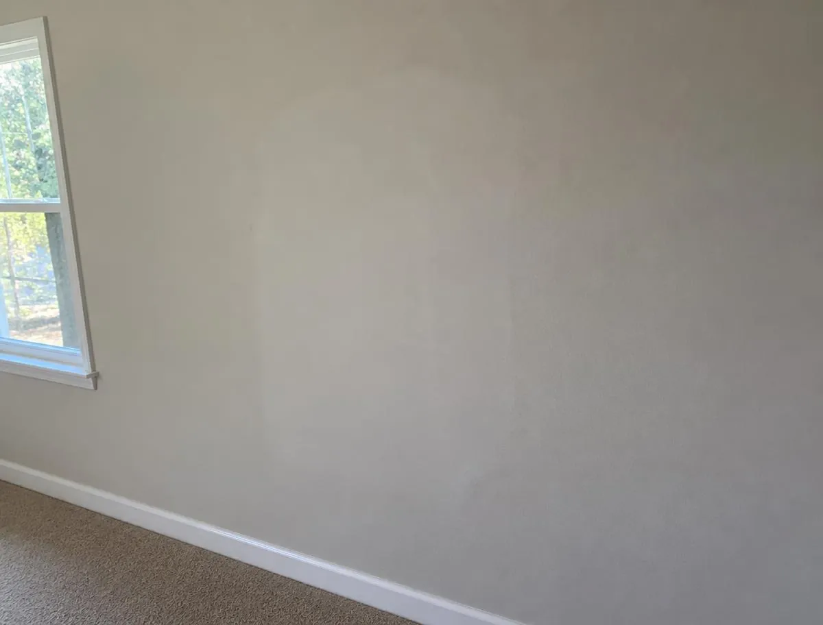 Representative example of interior wall repair and restoration with smooth, paint-ready drywall