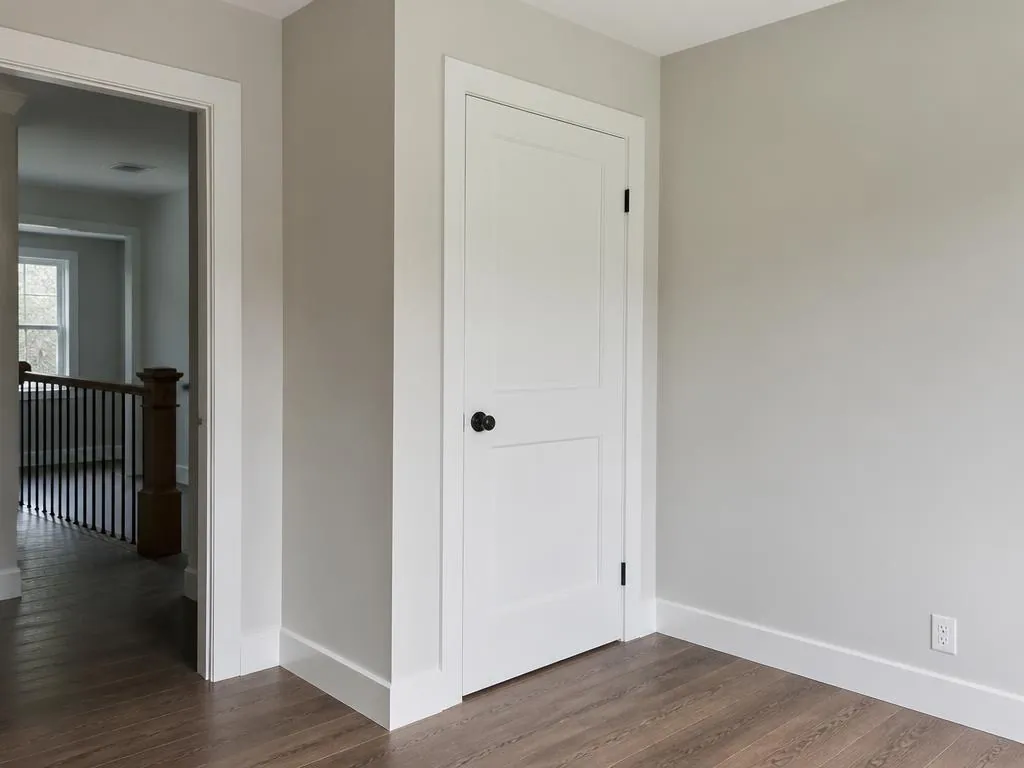 Finished interior door with new casing and baseboards